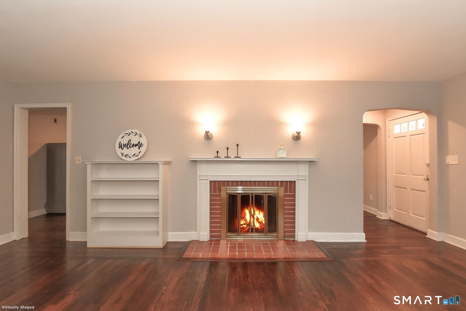 63 Park Road Hamden, CT 06517 - Photo 8 of 39 a living room with wooden floors and a fireplace