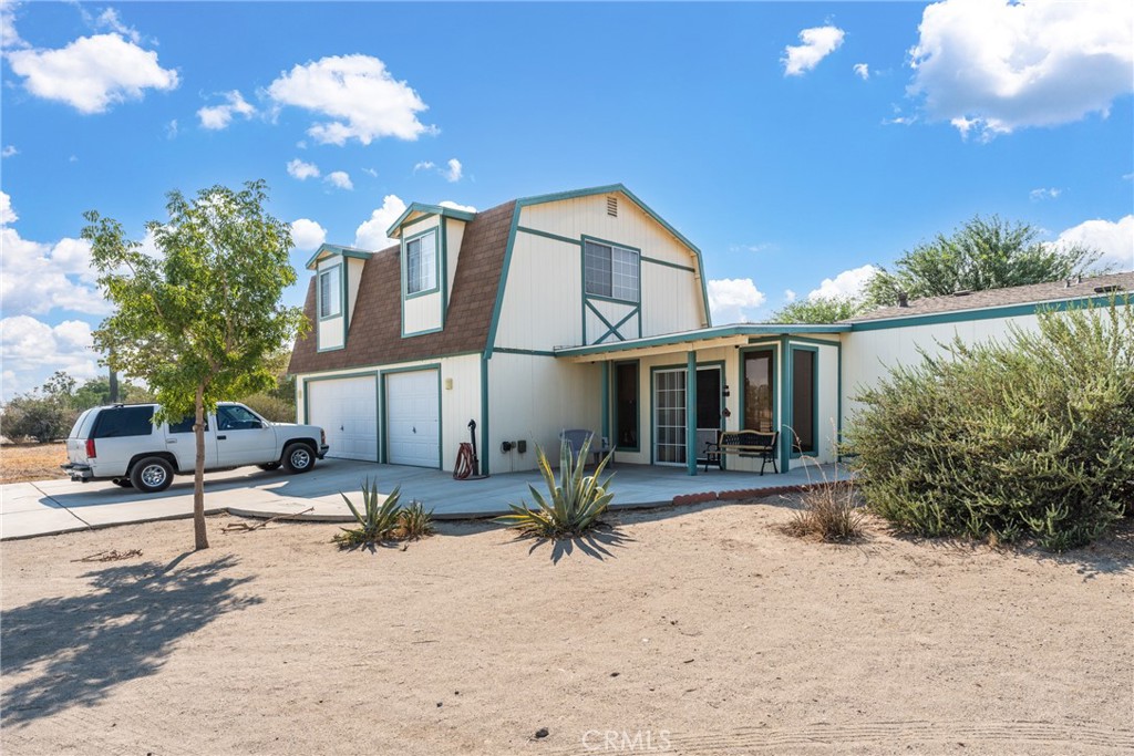 5133 Luna Road Phelan, CA 92371 - Photo 1 of 1 a view of a house with a patio