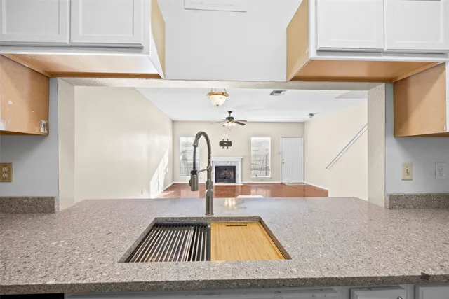 a view of a living room and kitchen