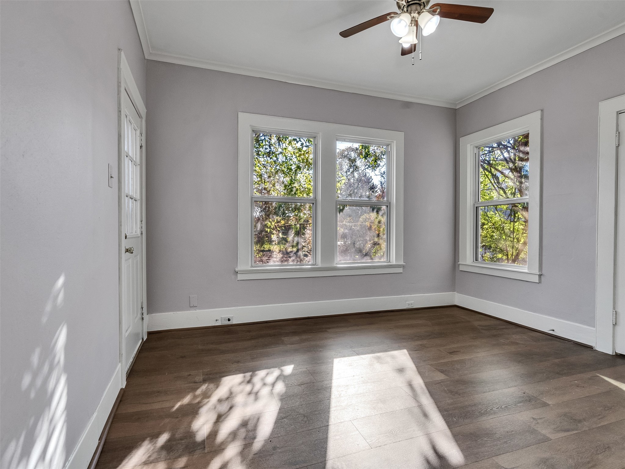 4625 Bell Street Houston, TX 77023 - Photo 12 of 33 a view of room with window and hardwood floor