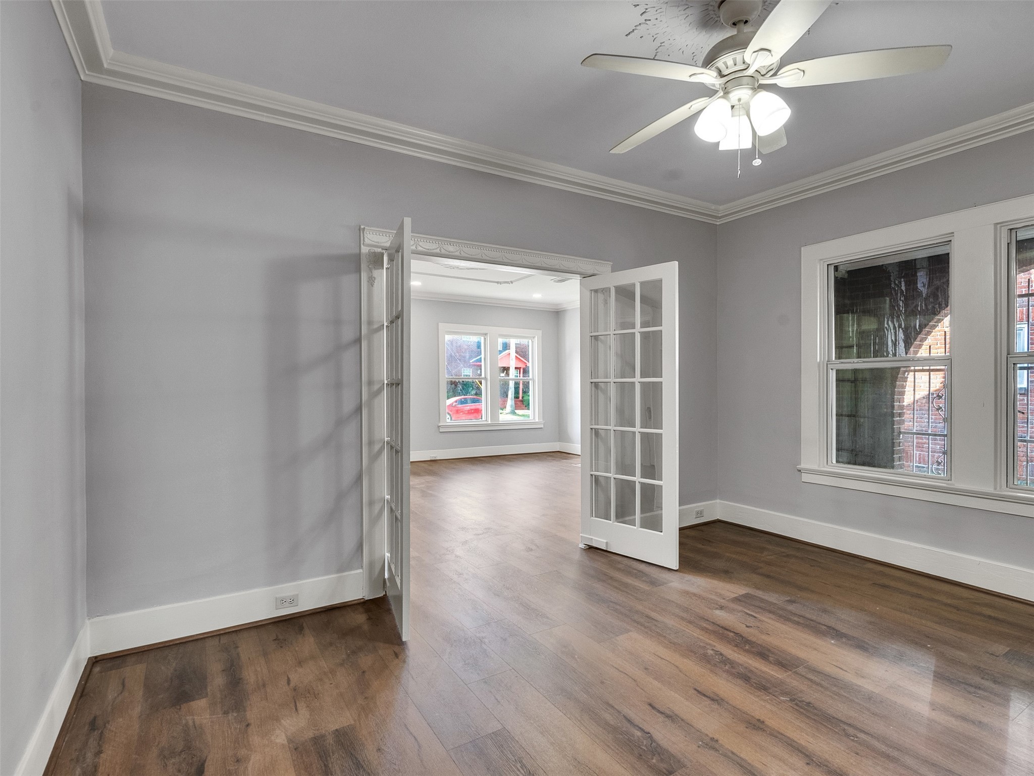 4625 Bell Street Houston, TX 77023 - Photo 16 of 33 wooden floor in an empty room with a window