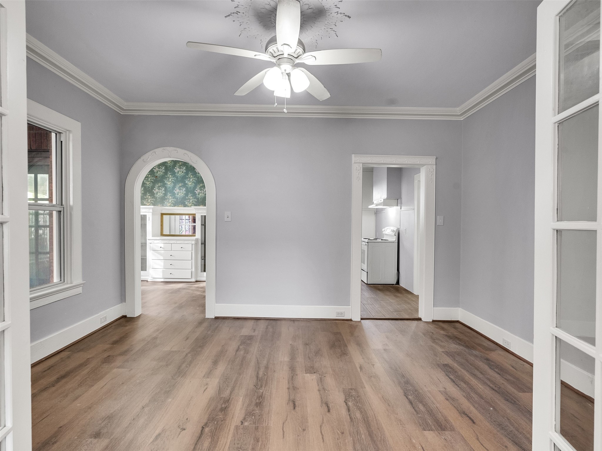 4625 Bell Street Houston, TX 77023 - Photo 17 of 33 a view of empty room with window and wooden floor