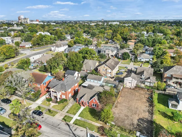an aerial view of residential houses with outdoor space
