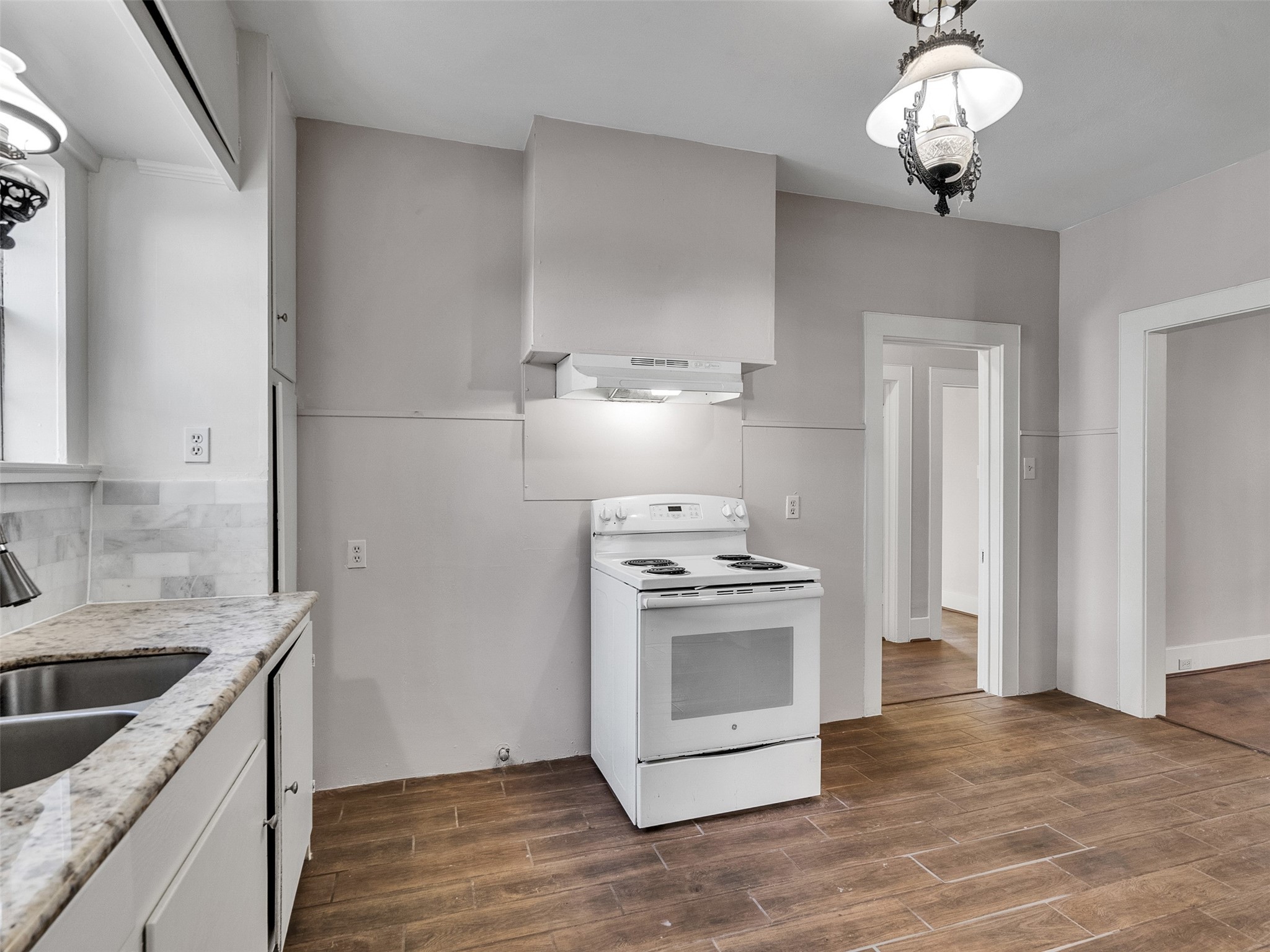 4625 Bell Street Houston, TX 77023 - Photo 23 of 33 a kitchen with a stove and a sink