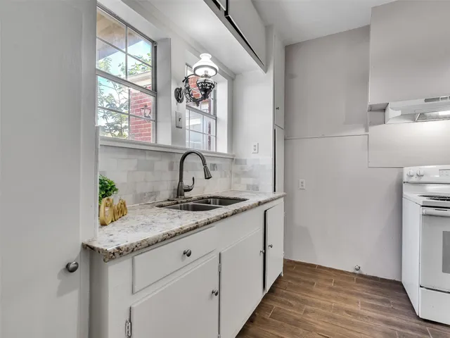 a kitchen with sink and window