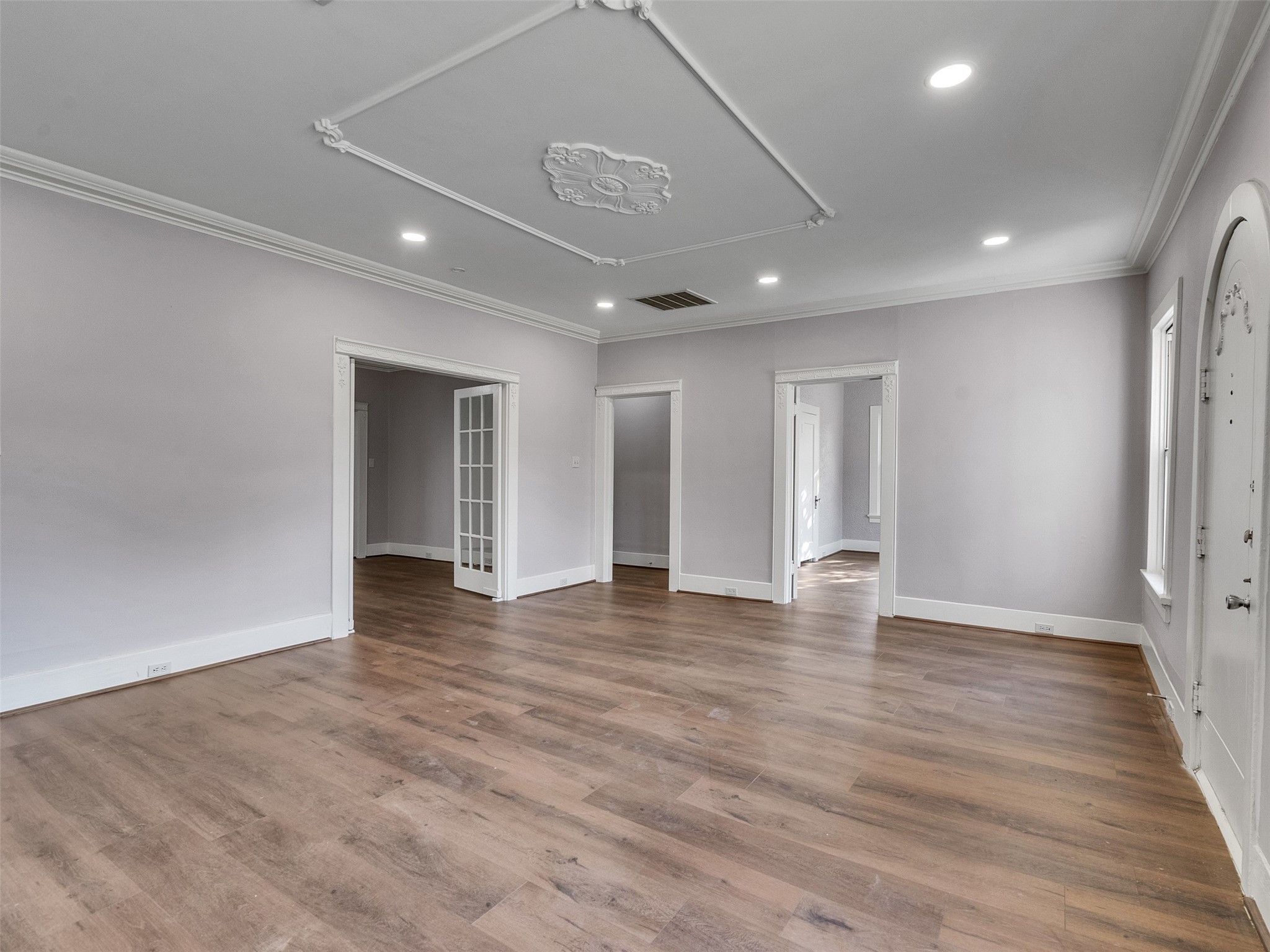 4625 Bell Street Houston, TX 77023 - Photo 6 of 33 a view of an empty room with wooden floor