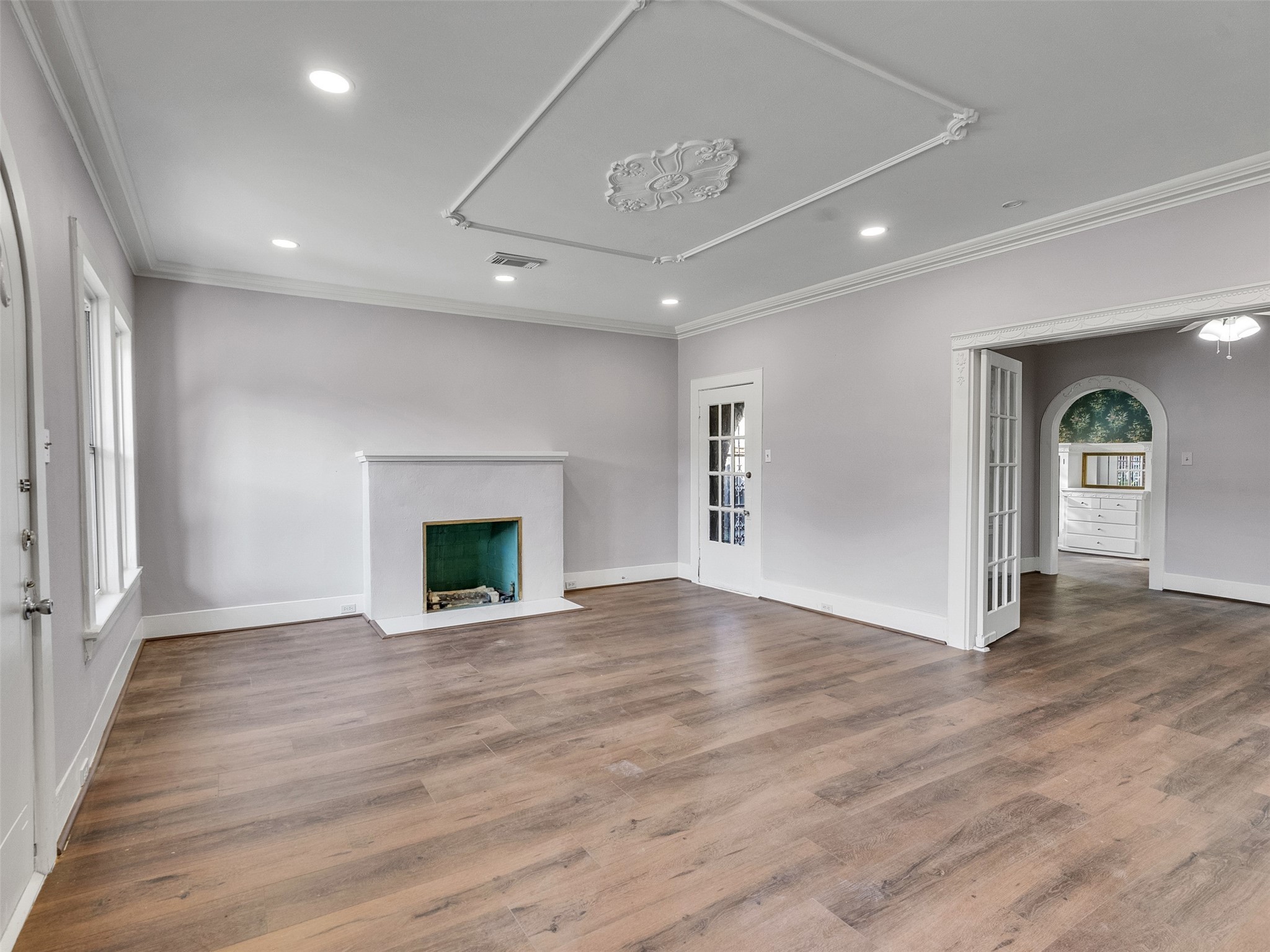 4625 Bell Street Houston, TX 77023 - Photo 7 of 33 a view of an empty room with window and fire place
