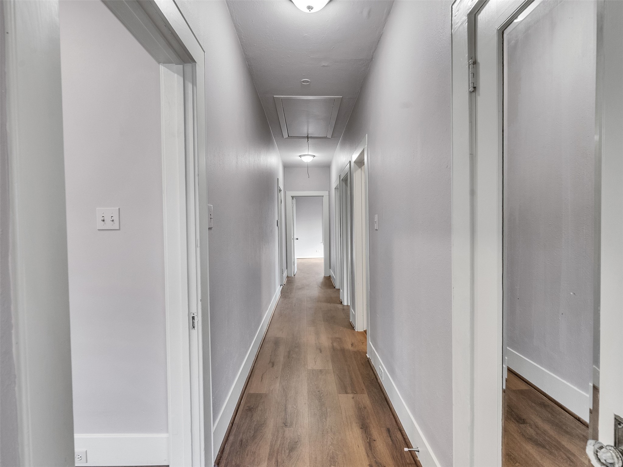 4625 Bell Street Houston, TX 77023 - Photo 10 of 33 a view of a hallway with wooden floor