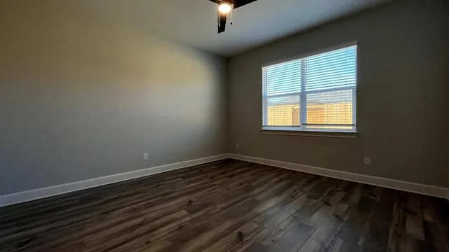 an empty room with closet area