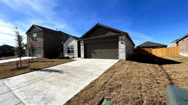 a kitchen with a sink and white cabinets