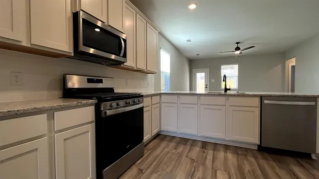 a view of kitchen and windows
