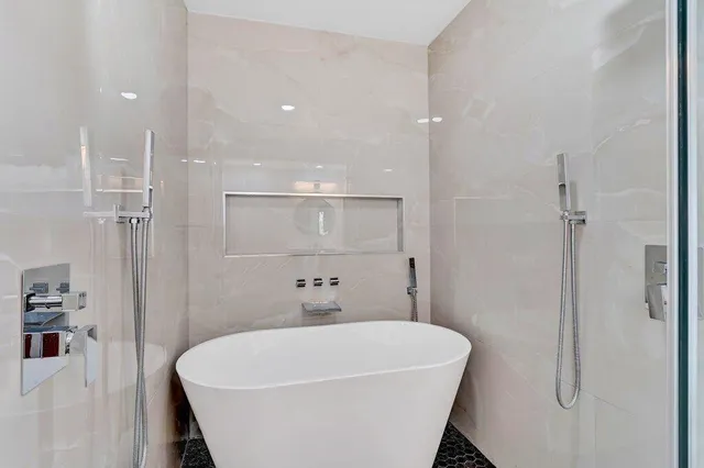 a bedroom that has a bed and a chandelier