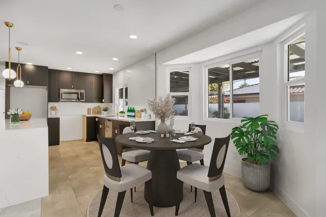a view of a kitchen with a refrigerator and a sink