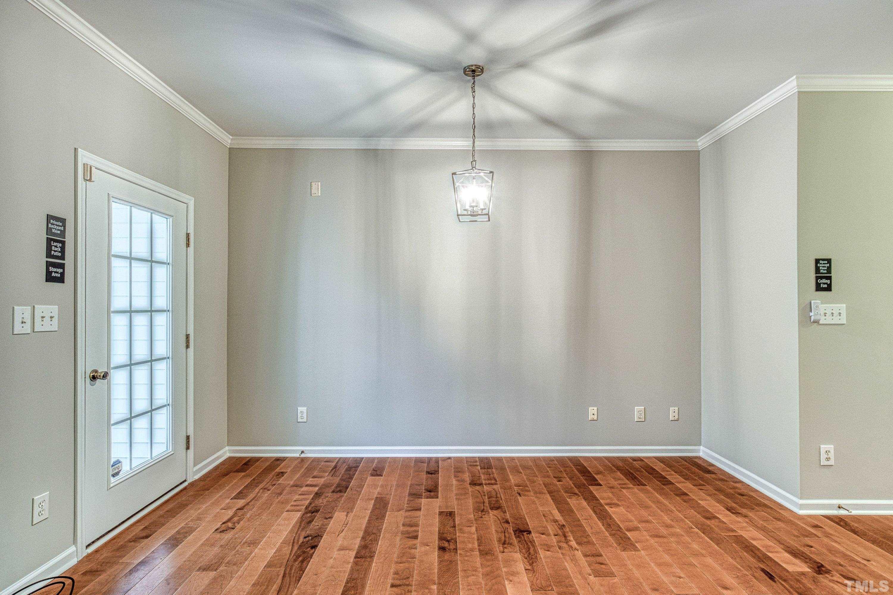 3045 Coxindale Drive Raleigh, NC 27615 - Photo 17 of 42 a view of an empty room with wooden floor and a window