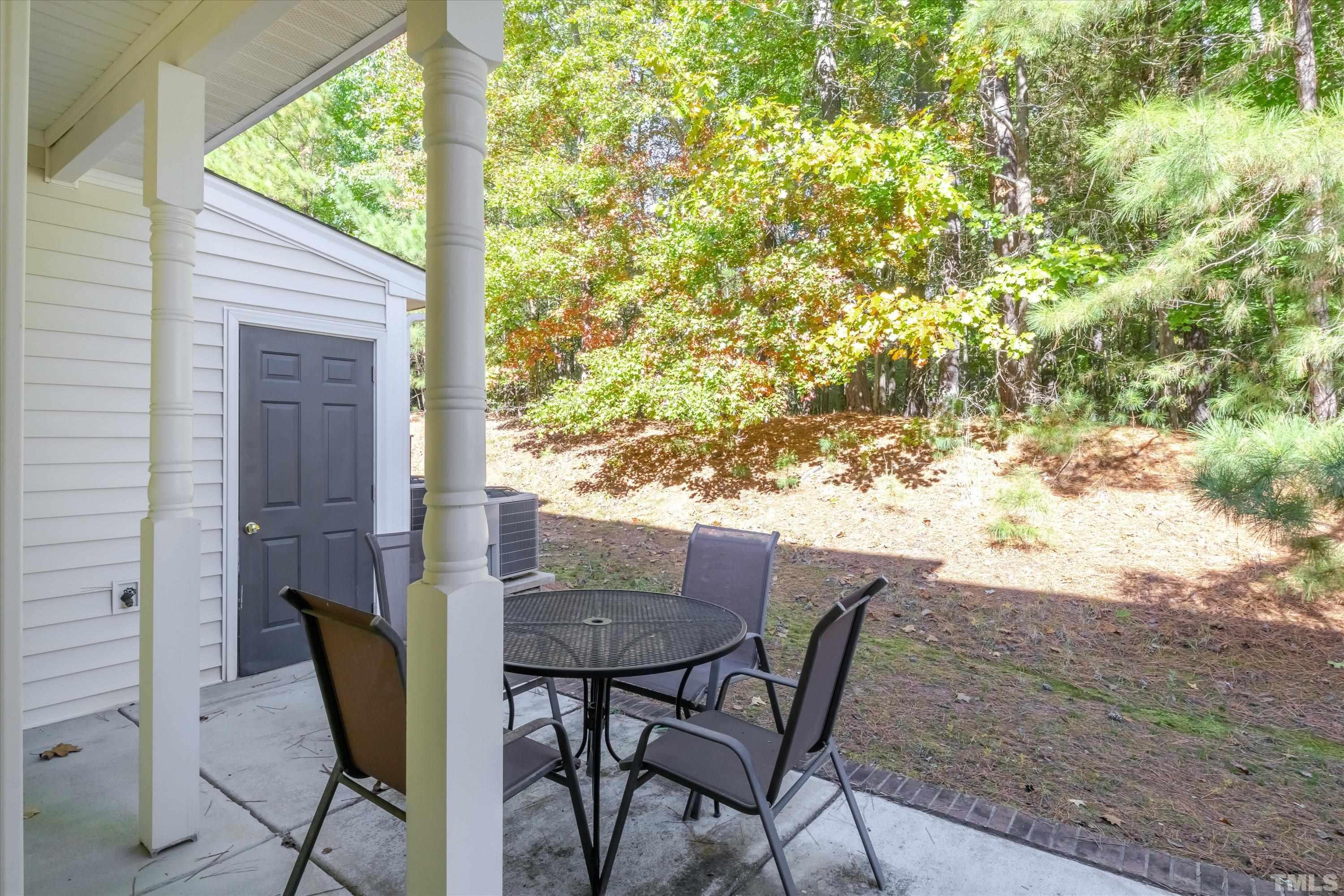 3045 Coxindale Drive Raleigh, NC 27615 - Photo 19 of 42 a view of an outdoor dining space with a table and chairs