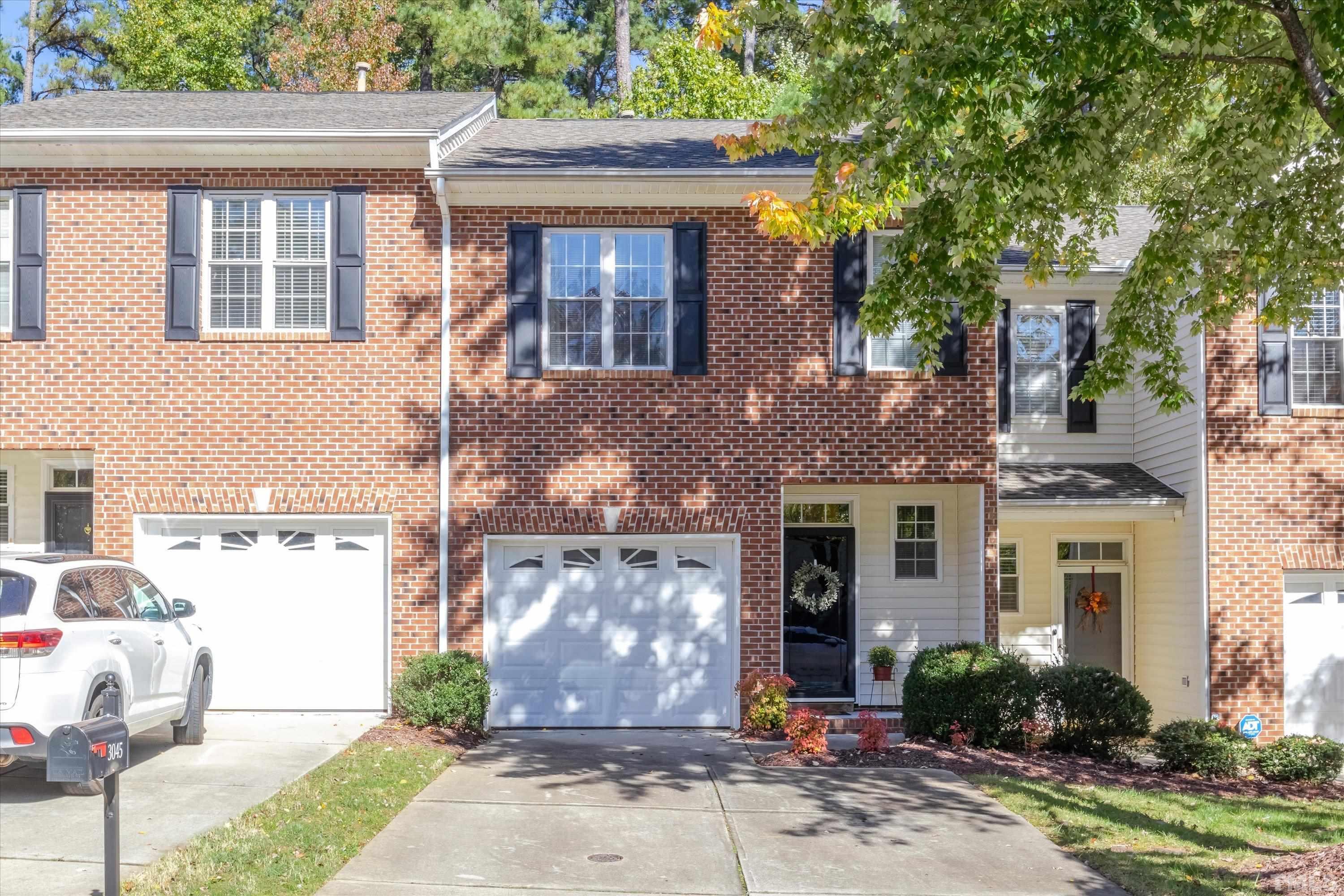 3045 Coxindale Drive Raleigh, NC 27615 - Photo 2 of 42 a front view of a house with garden