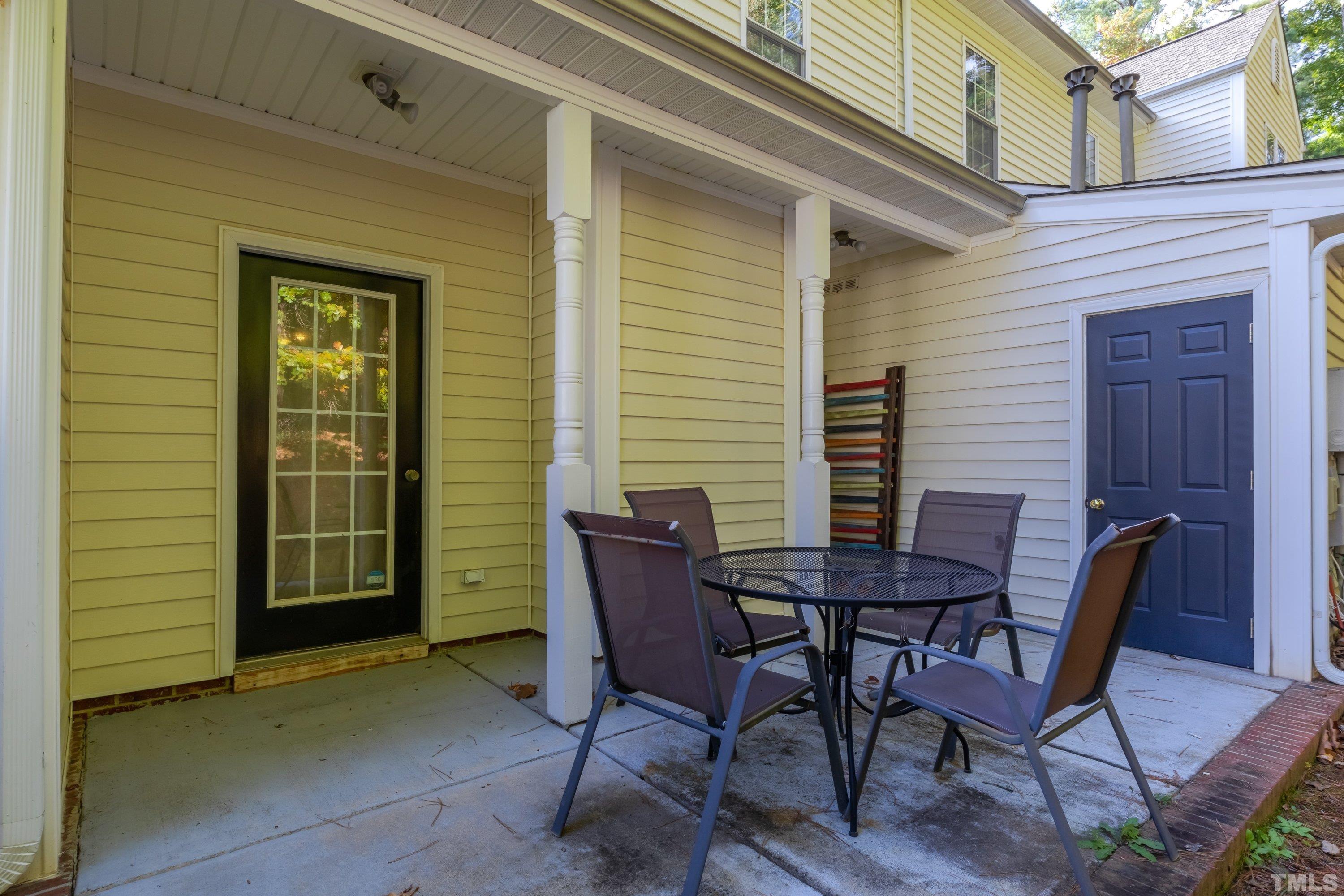 3045 Coxindale Drive Raleigh, NC 27615 - Photo 22 of 42 a view of a wooden bench in a patio