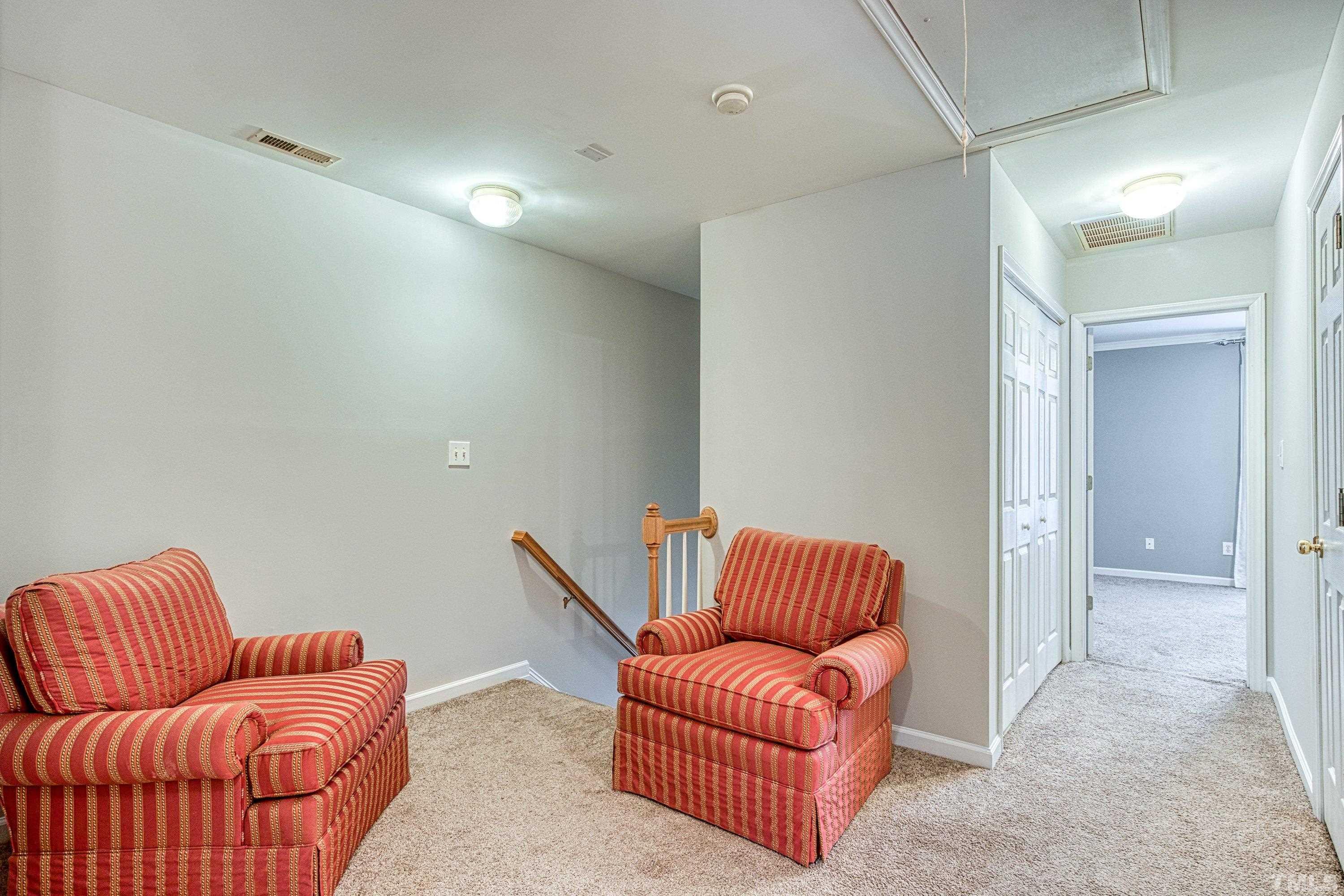 3045 Coxindale Drive Raleigh, NC 27615 - Photo 23 of 42 a room with furniture and a couch