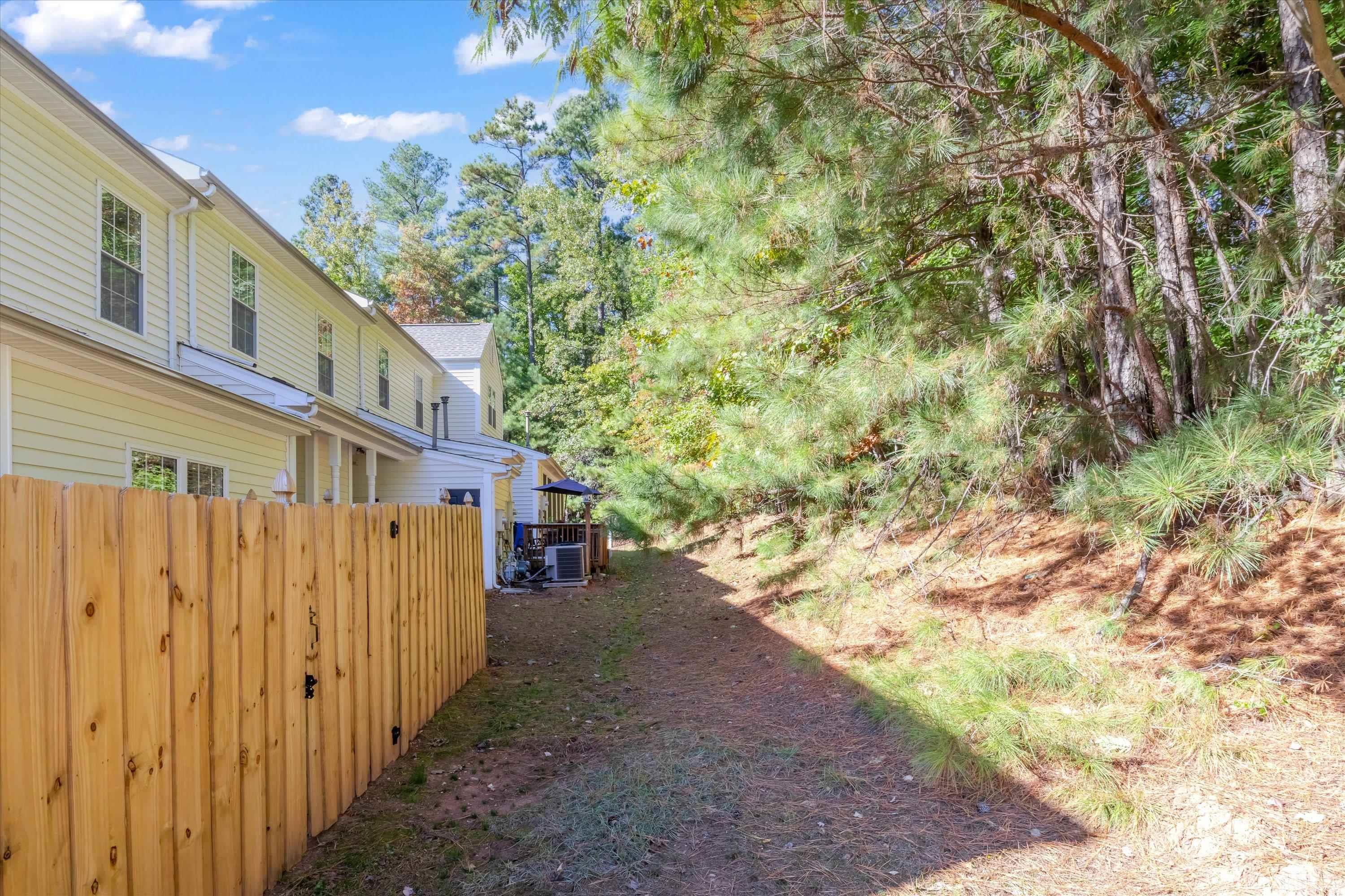 3045 Coxindale Drive Raleigh, NC 27615 - Photo 39 of 42 a view of a house with a yard