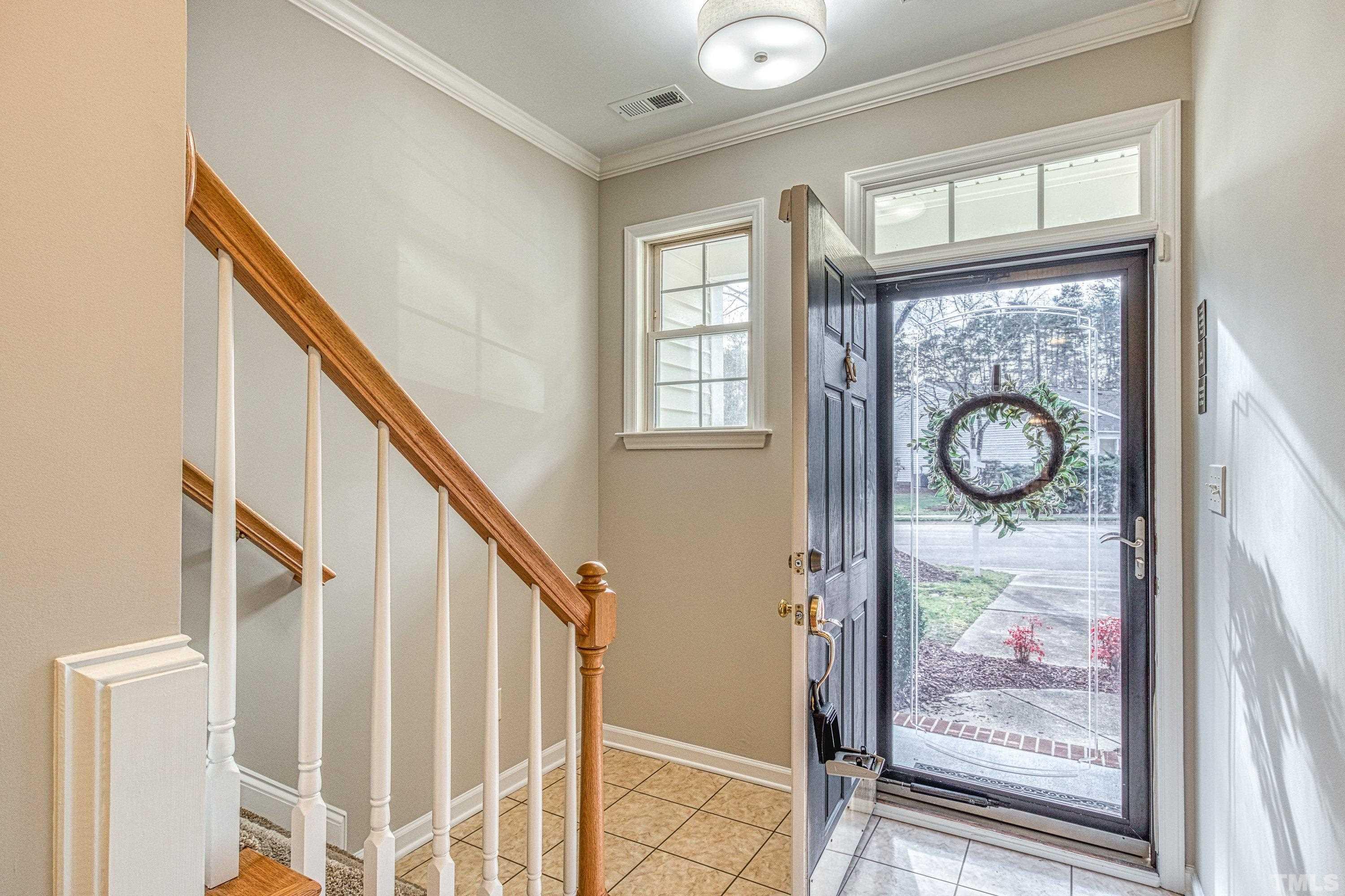 3045 Coxindale Drive Raleigh, NC 27615 - Photo 4 of 42 a view of entryway with wooden floor