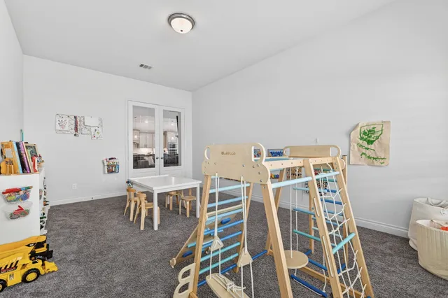 a view of a workspace with furniture and wooden floor