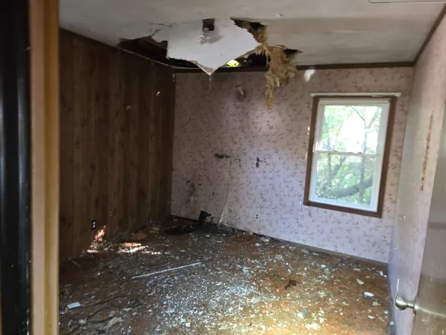a view of a bathroom with shower and a yard