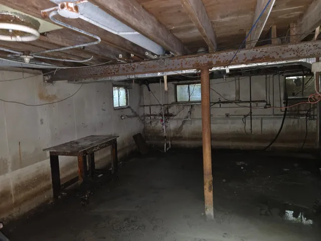 a view of a room with wooden walls