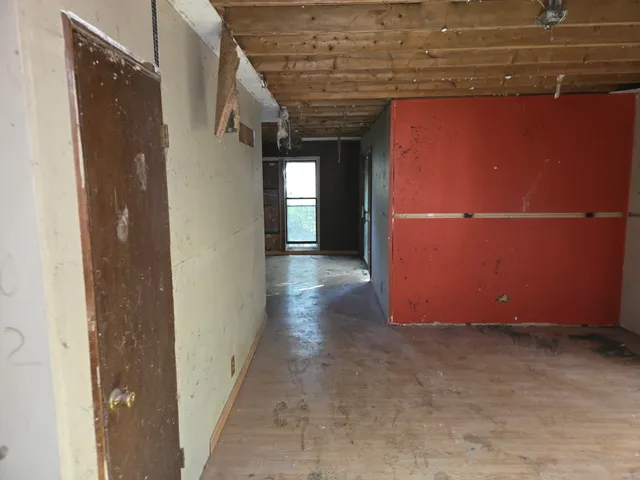 a view of a room with wooden walls