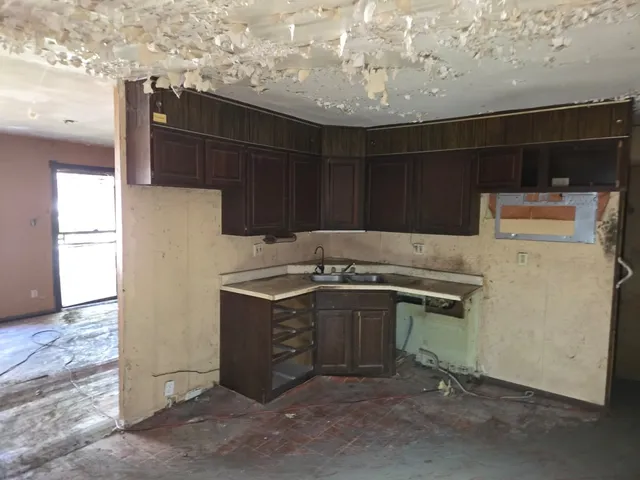 a kitchen with a stove and a refrigerator