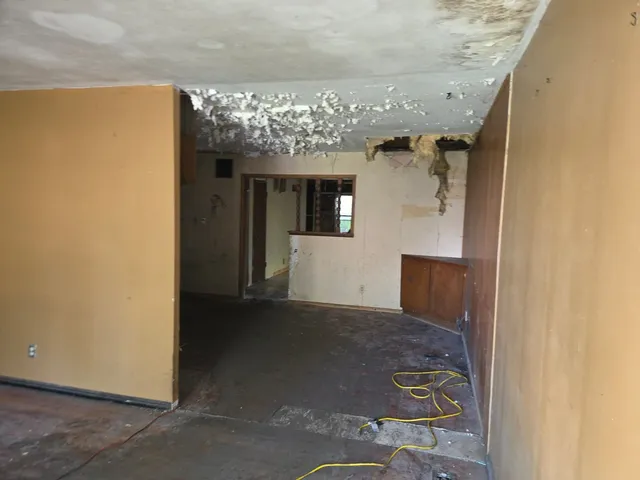 a view of a big room with windows