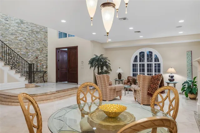a kitchen with sink and view of living room