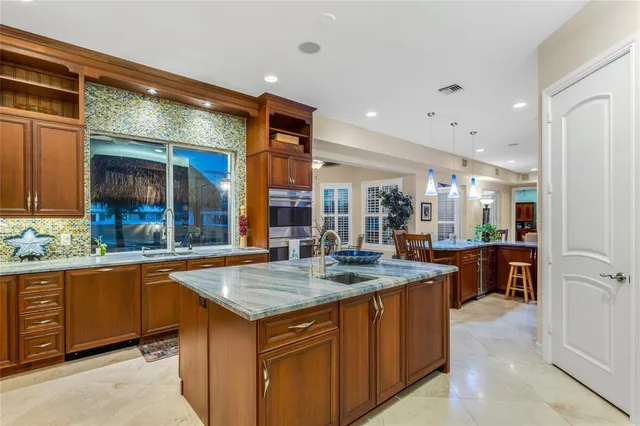 a kitchen with a table and chairs in it