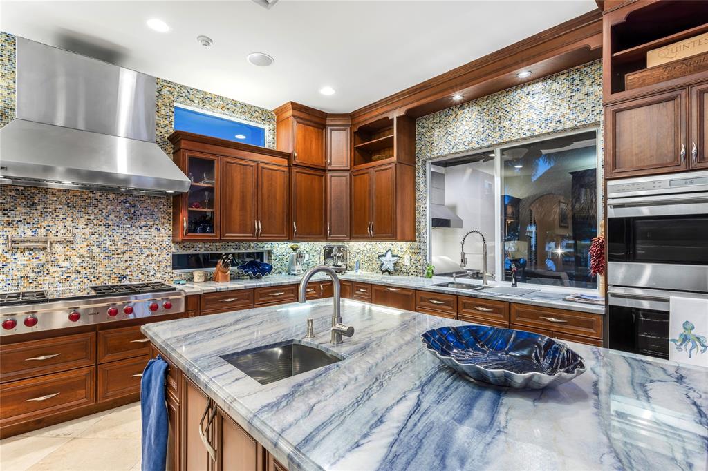 3489 Northeast 30th Avenue Lighthouse Point, FL 33064 - Photo 14 of 42 a kitchen with a sink and cabinets