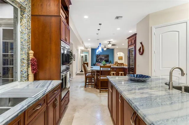 a view of kitchen with furniture and a large window