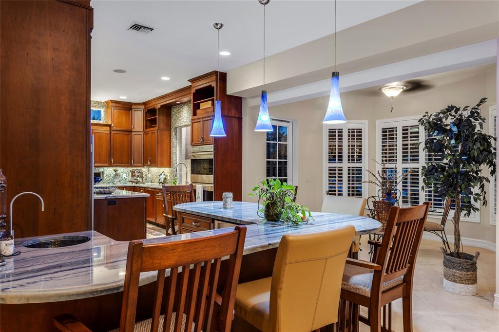 3489 Northeast 30th Avenue Lighthouse Point, FL 33064 - Photo 17 of 42 a view of a dining room with furniture and window