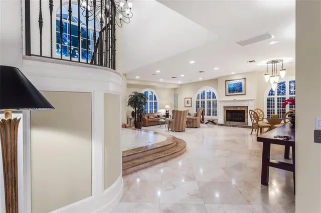 a living room with furniture and kitchen view