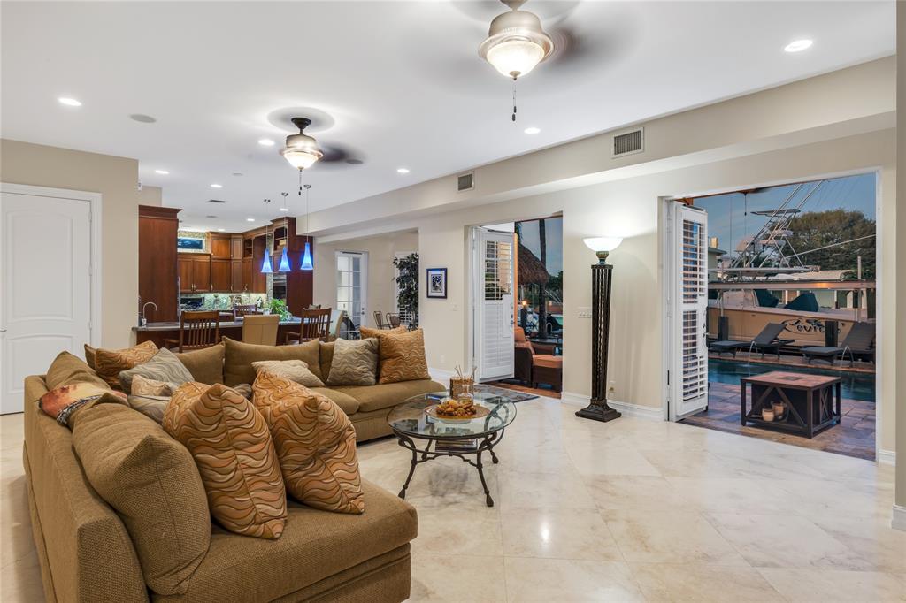 3489 Northeast 30th Avenue Lighthouse Point, FL 33064 - Photo 19 of 42 a living room with furniture and kitchen view