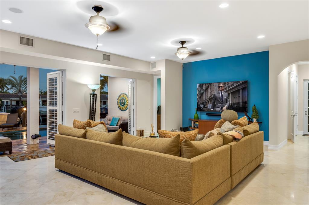 3489 Northeast 30th Avenue Lighthouse Point, FL 33064 - Photo 20 of 42 a living room with furniture and a chandelier