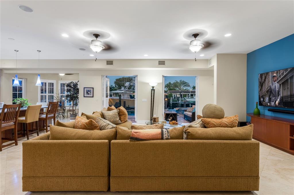 3489 Northeast 30th Avenue Lighthouse Point, FL 33064 - Photo 21 of 42 a living room with furniture and wooden floor