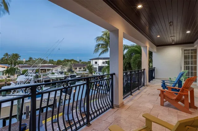 a view of a living room and balcony