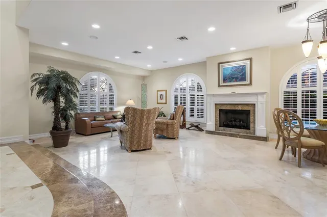 a view of a livingroom with furniture window and wooden floor