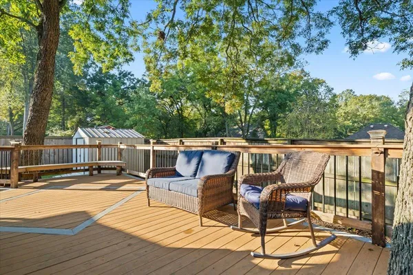 a view of a patio with wooden floor