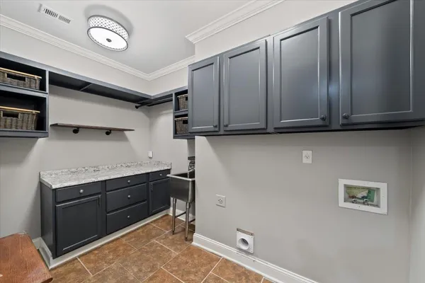 a room with cabinets and wooden floor