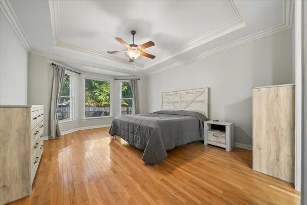 a bedroom with a large bed and a window