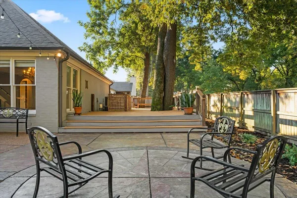 a view of a chairs and tables in the balcony
