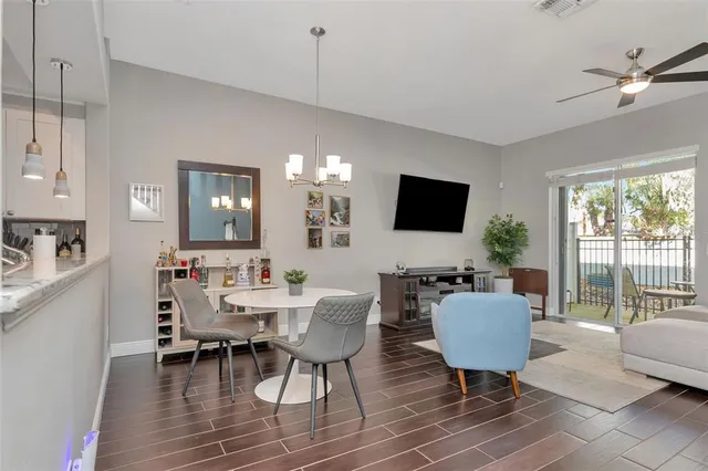 a view of a dining room with furniture and wooden floor