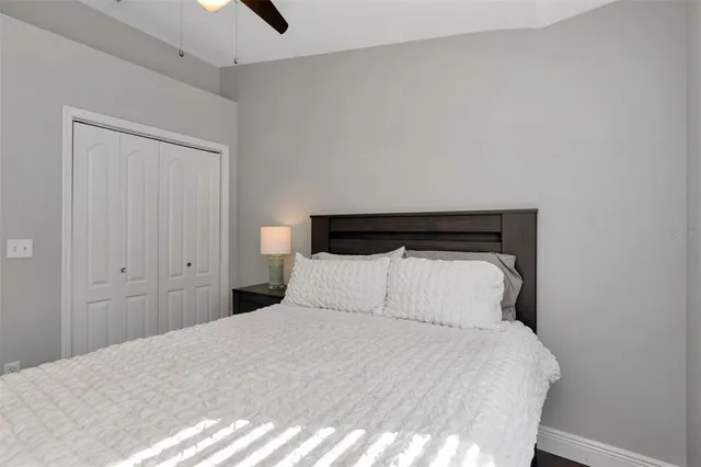 a bedroom with bed and a window