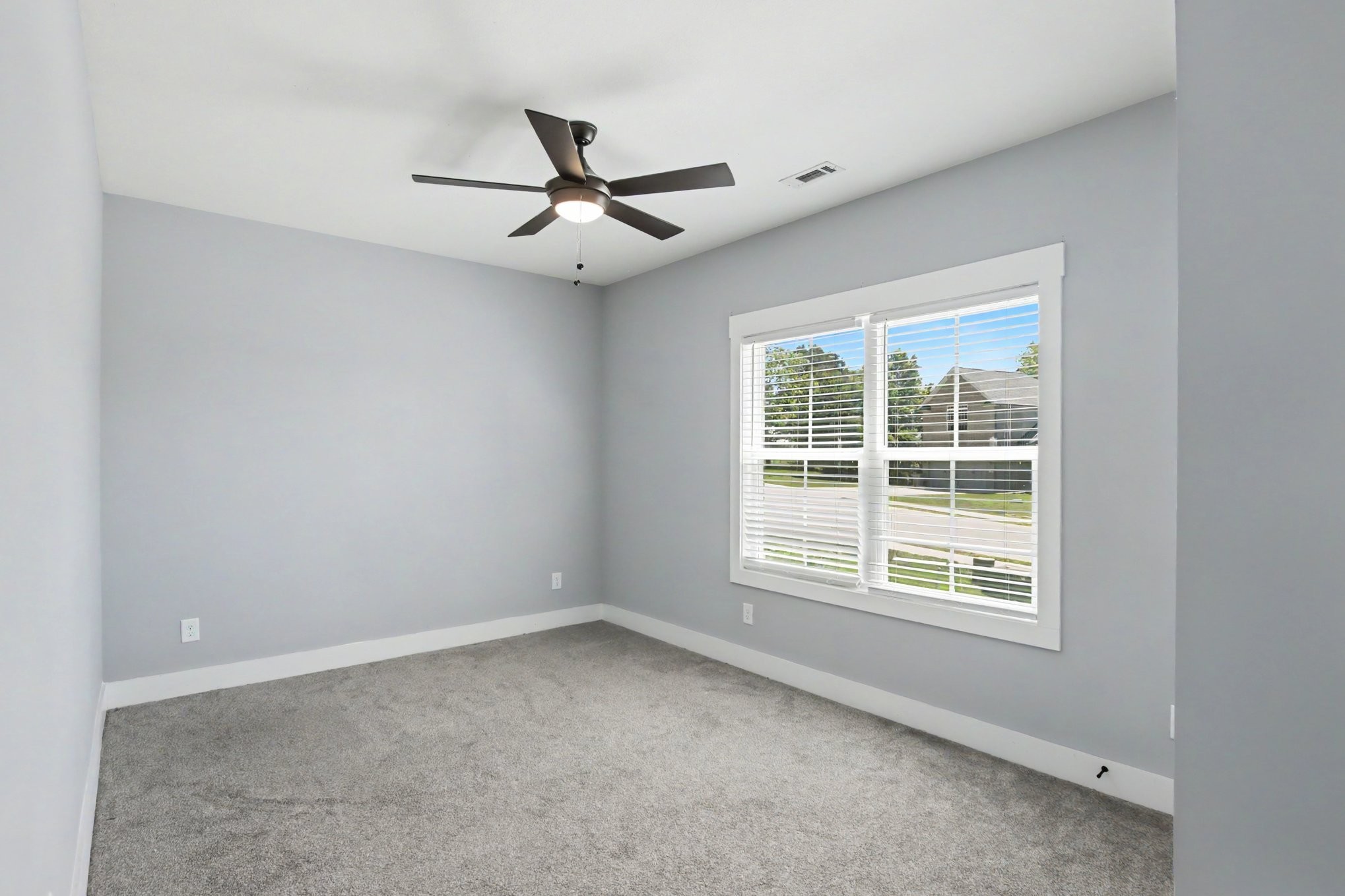 7208 Winding Way Pleasant View, TN 37146 - Photo 24 of 30 an empty room with a window and a fan