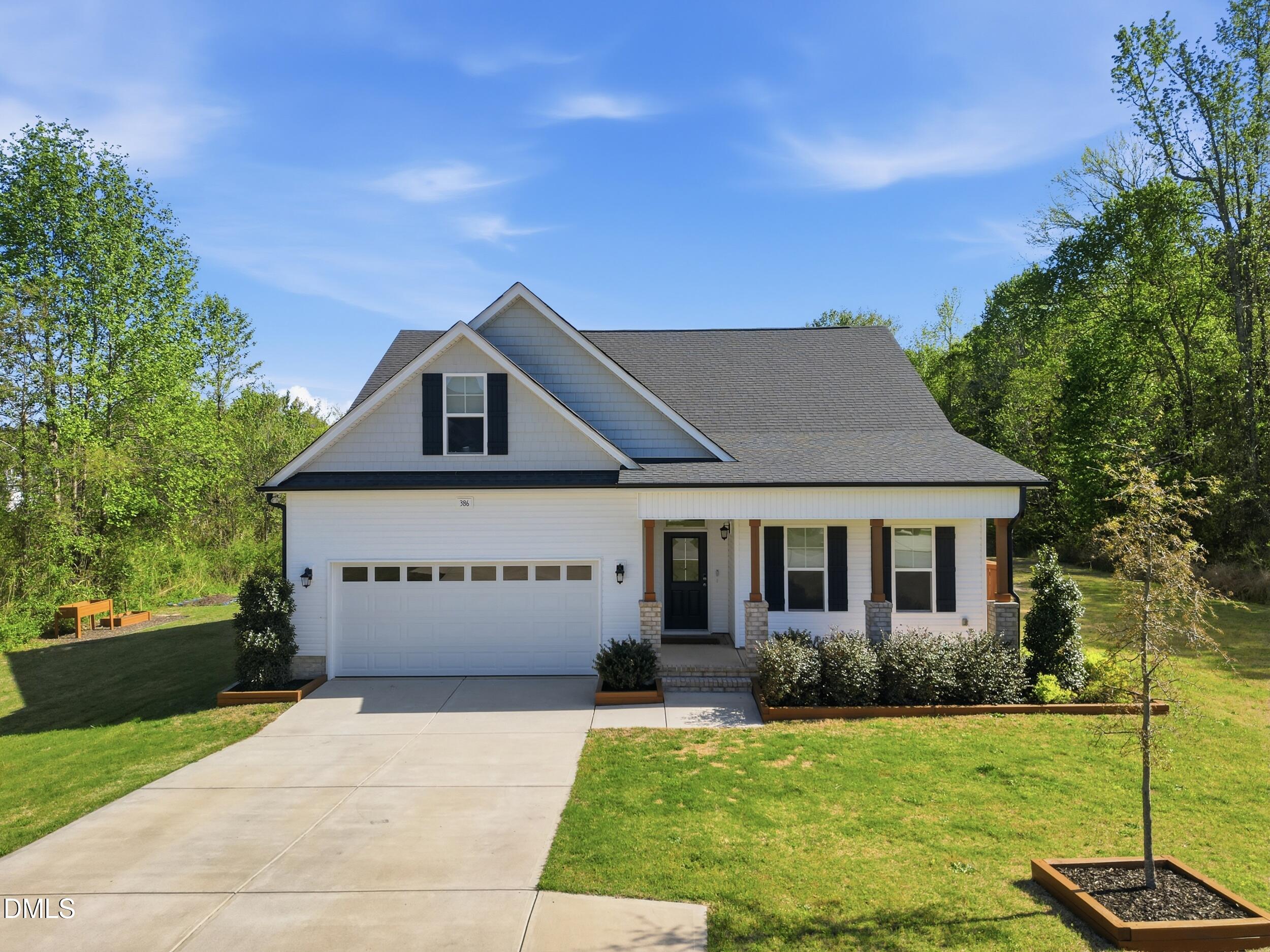 386 Howards Crossing Drive Wendell, NC 27591 - Photo 3 of 31 a front view of a house with a yard