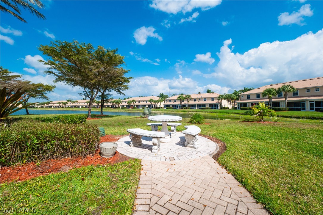 11677 Eros Road Lehigh Acres, FL 33971 - Photo 23 of 27 a view of a garden with houses